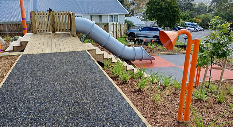 Taurus Crescent Reserve - Bright orange talking tube with the tube slide running down the slope in the background.