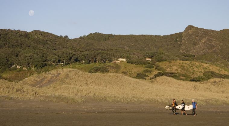 Te Henga (Bethells Beach), Waitākere Ranges Regional Park - Full moon rising on surfers.