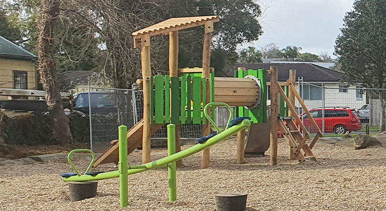Urlich Esplanade Reserve - Climbing frame with tunnel, ramp and slide, with a seesaw in the foreground.