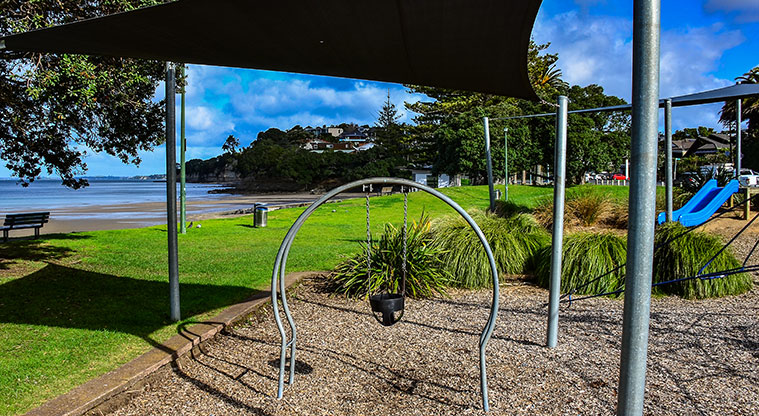 Waiake Beach Reserve - Baby swing under a shade sail. Photo credit: Aleksandar Ćirilović.