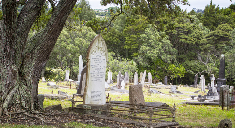 Waikumete Cemetery – Old grave plots among the trees in the historic section of the cemetery (Wesley Division A).