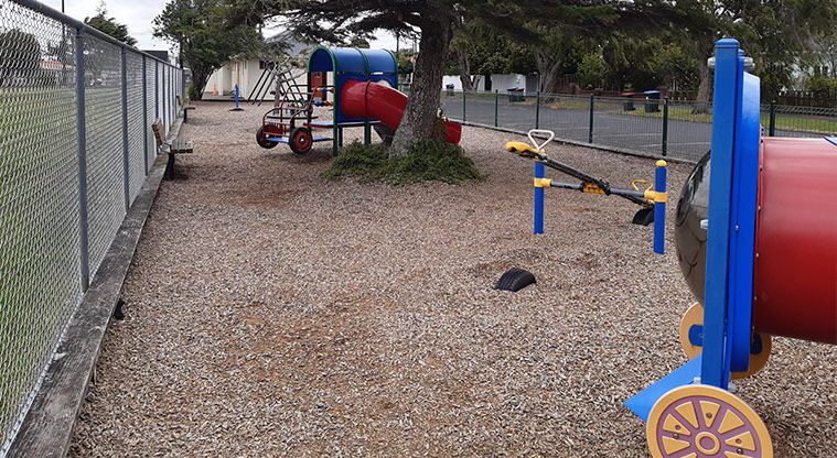 Walker Park - Playground with seating along the fenceline.