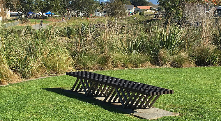 Walmsley Park – bench in a small open section of the park.