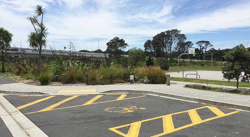 Waterview Reserve – Accessible car park at the Waterbank Crescent entrance, with the basketball court in the background.