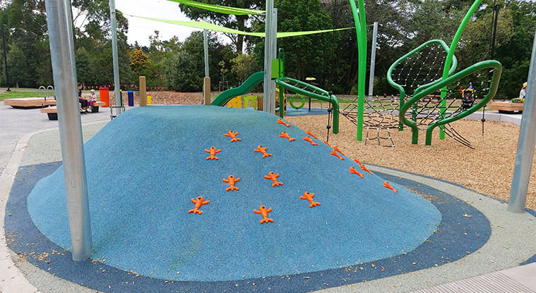 Western Springs Lakeside - Blue climbing mound with orange footholds.