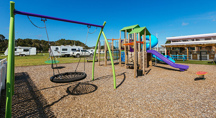 Accessible basket swing at Whangateau Holiday Park. Photo credit: B Lowe