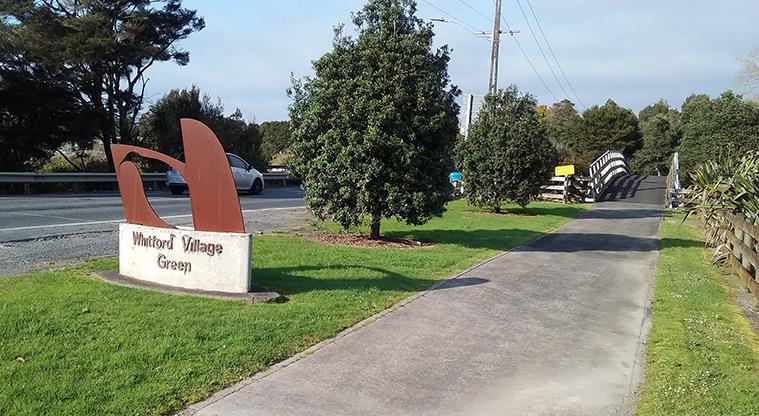Whitford Village Green - Sign on the side of the road by the entrance to the reserve.