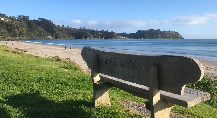 Onetangi Beach Path - Norm's seat at the western end of the beach. With a view out towards Thompson’s Point.