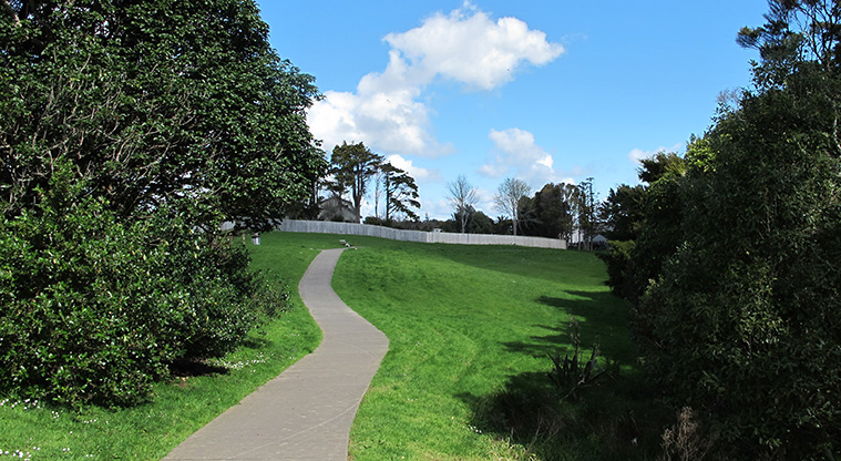 Point View Loop Path - A sealed path alongside a pocket of bush.