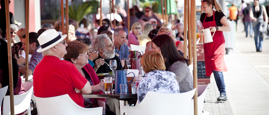 Diners at outdoor tables. 