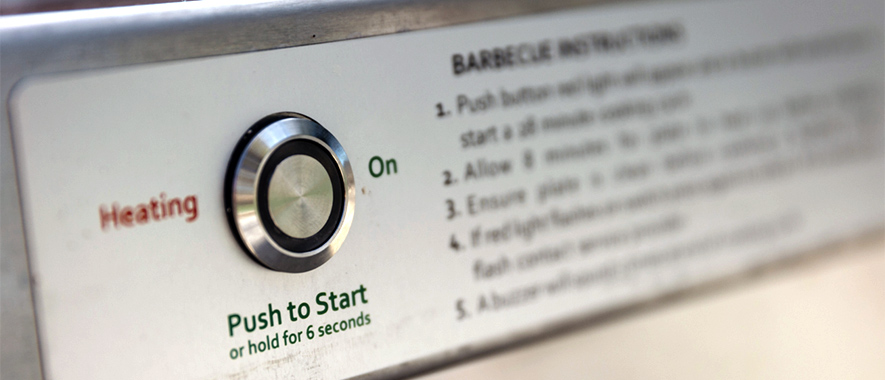 Start button for electric barbecue.