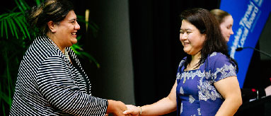 Photograph of two people at an Auckland event