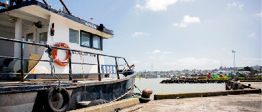 Photograph of boat moored at a wharf