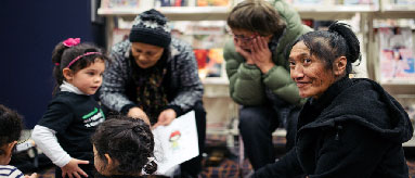 Photograph showing kids and parents at Auckland library.