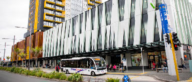 Bus parked outside a bus terminal.