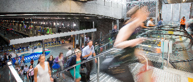 Photo showing people going up the escalator at Britomart Station.