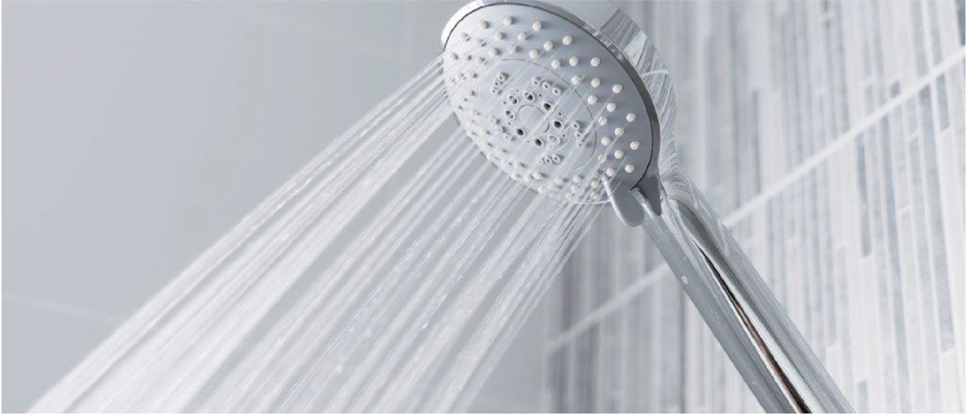 Shower head spouting a large jet of water.