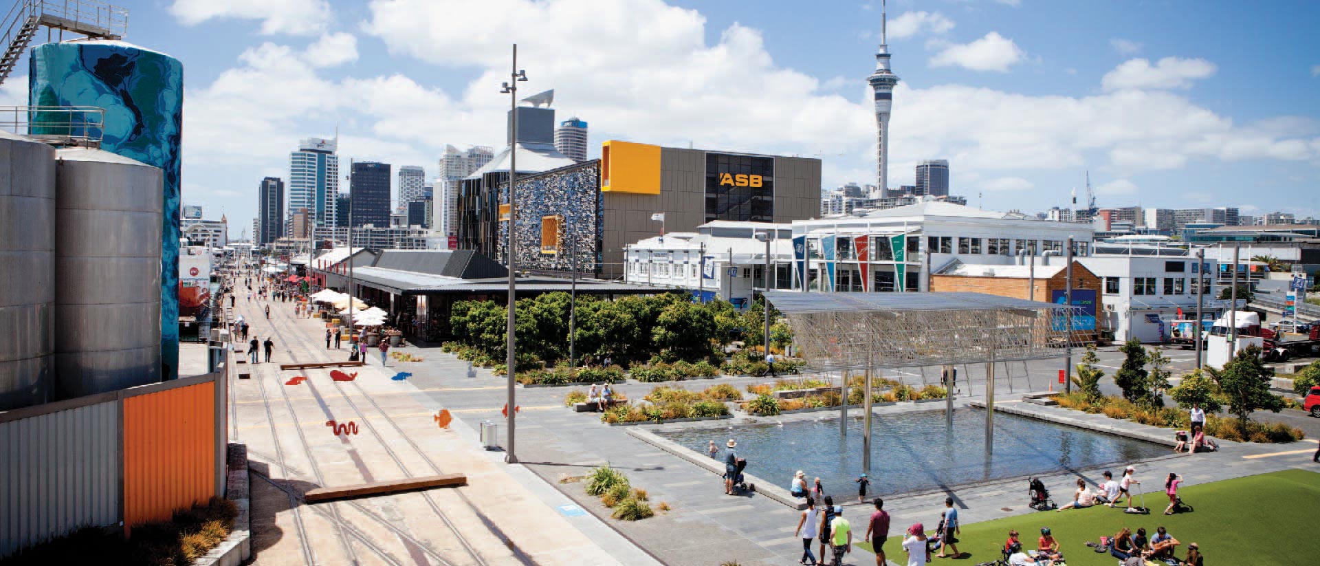 North Wharf's Silo Park and Wynyard Quarter bars and restaurants with the Sky Tower in the background.