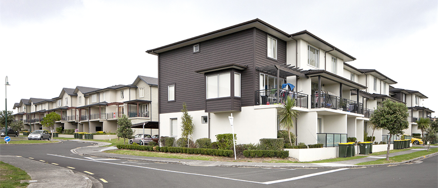 Row of townhouses on a suburban street. 